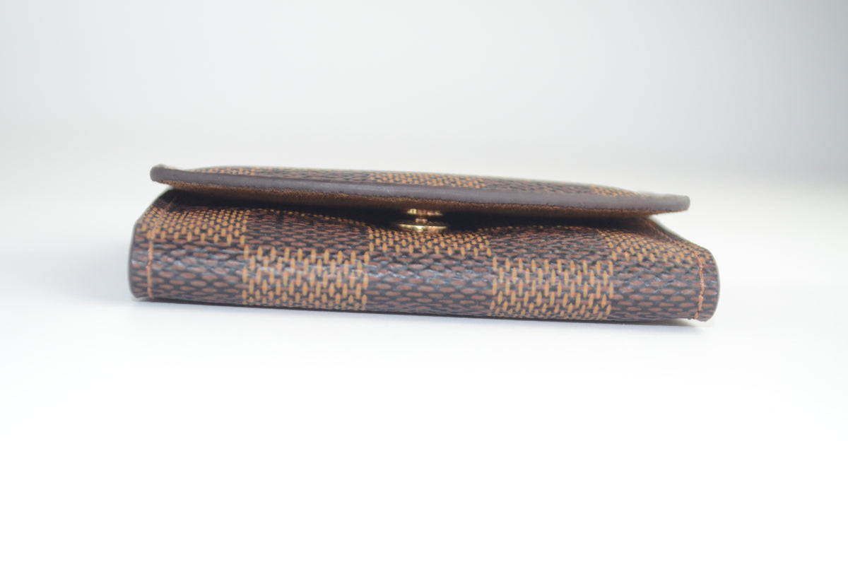 Louis Vuitton Manschettenknopf Halter Damier Ebene Canvas Braun
