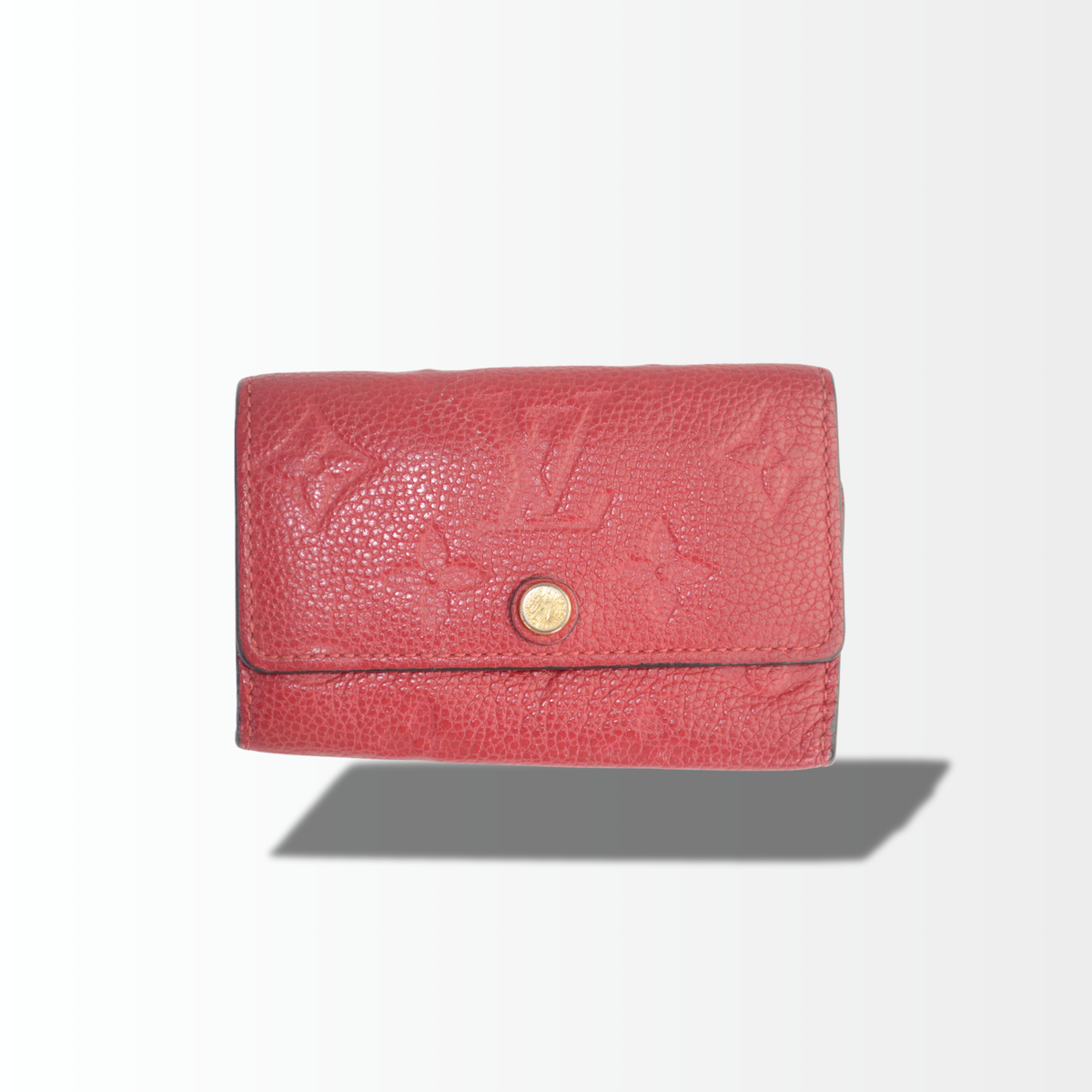 Louis Vuitton Multiclés 6 Schlüssel Etui aus rotem Monogram Empreinte Leder mit goldfarbenem Druckknopf.